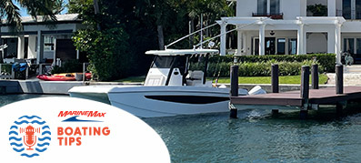 Boat at a private dock with the Boating Tips Logo