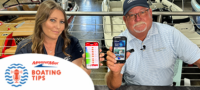 Two captains holding phones with boating apps