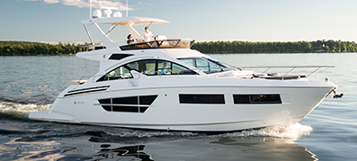 a white cruiser yacht sails on the water
