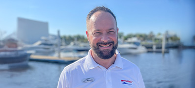 Jody Mitchell, the new MarineMax Jacksonville General Manager, stands in front of a marina