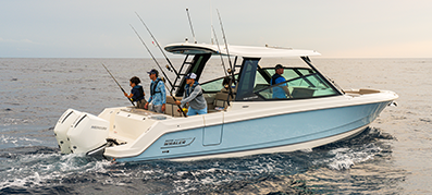 A light blue motorboat with four people fishing in open water.
