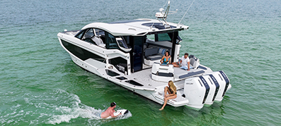 A Galeon with Mercury outboard engines and boaters enjoying the water
