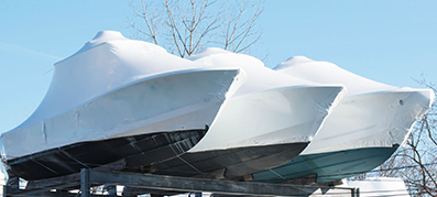 Three wrapped boats for winterization