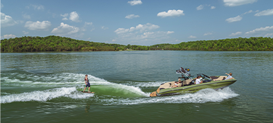man wakesurfing on the back of a MasterCraft NXT