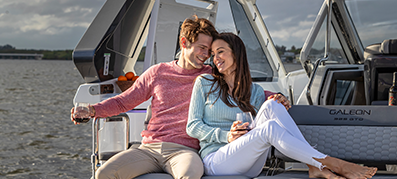 man and a women on a boat cuddling