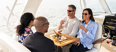 2 couples enjoying a boat 