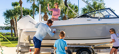 A family trailering their boat