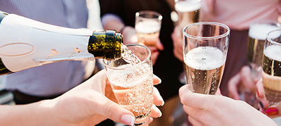 Hands holding champagne glasses