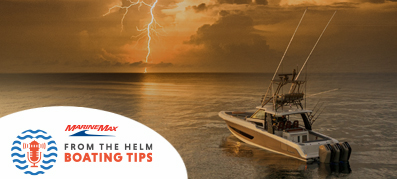 Boat in the water with lightning in the distance