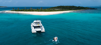A charter boat sails through the Bahamas