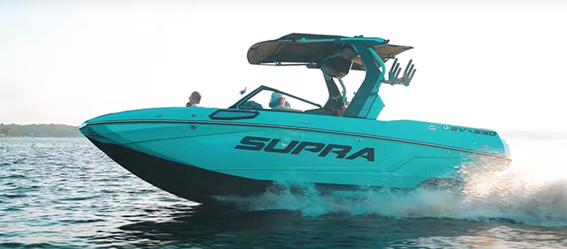 2024 Supra Boat in the water in blue-green color