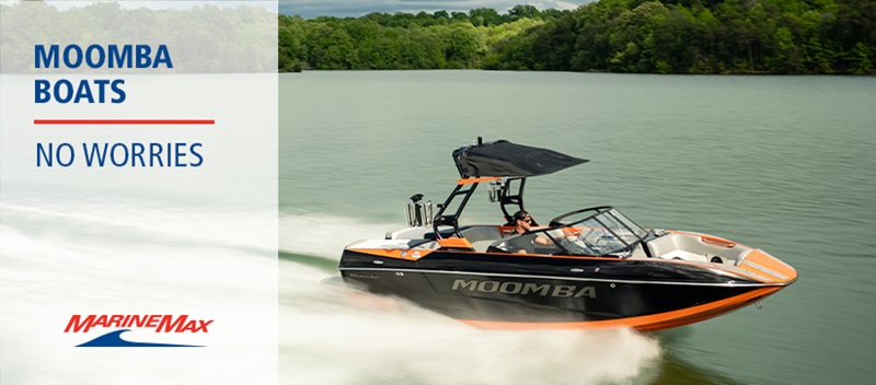 An orange and black Moomba boat moves at top speed