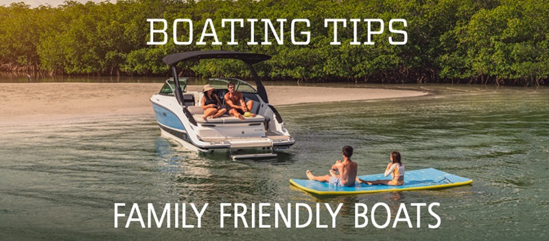 A family enjoys swimming around an anchored boat