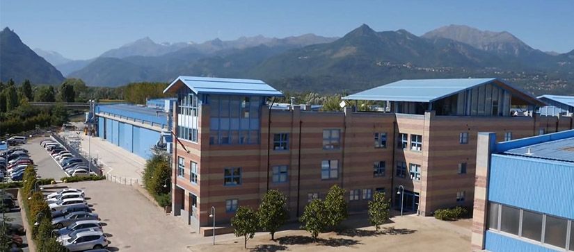 azimut factory building with mountains in the background