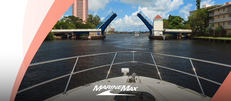 A boat moves towards an open drawbridge