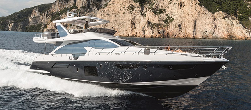 Azimut 72 Flybridge cruising through water with cliffs behind it