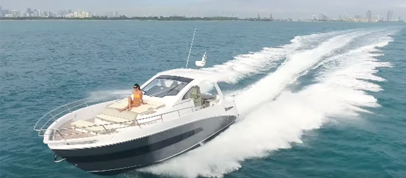boat running on water, woman sitting on the deck