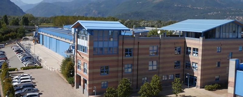 building in the foreground and cars on the side