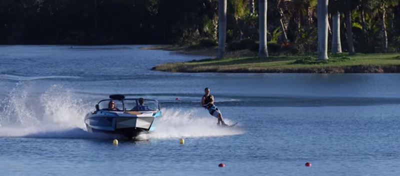 boat on water with waterskiier