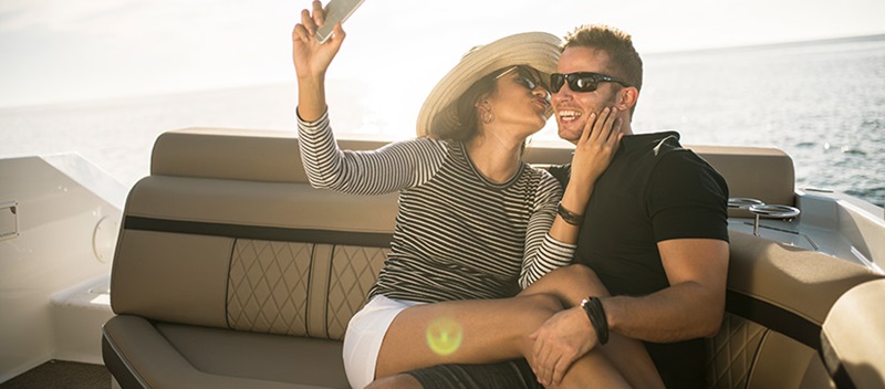 Coupe taking a selfie on a Sea Ray - Sea Ray SLX Experience Video