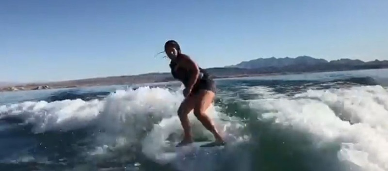 A woman wakesurfing