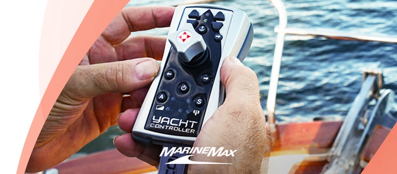 A hand holds a yacht controller device