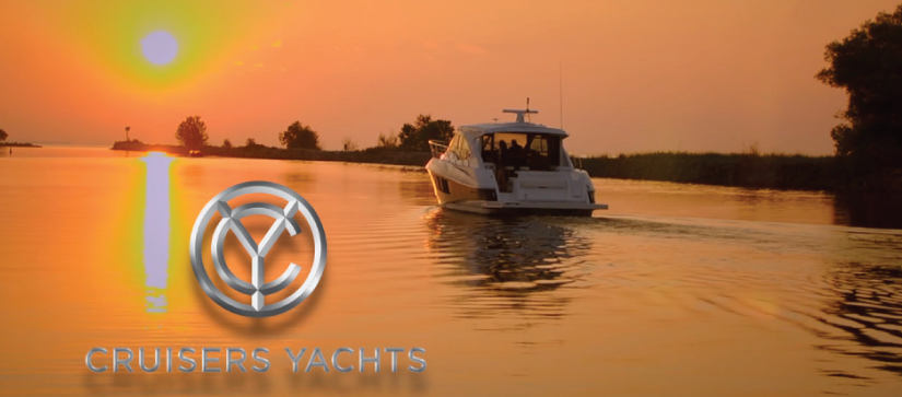 Cruisers Yacht out on the water during a sunset