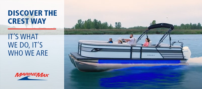 Crest pontoon with blue lights in the water