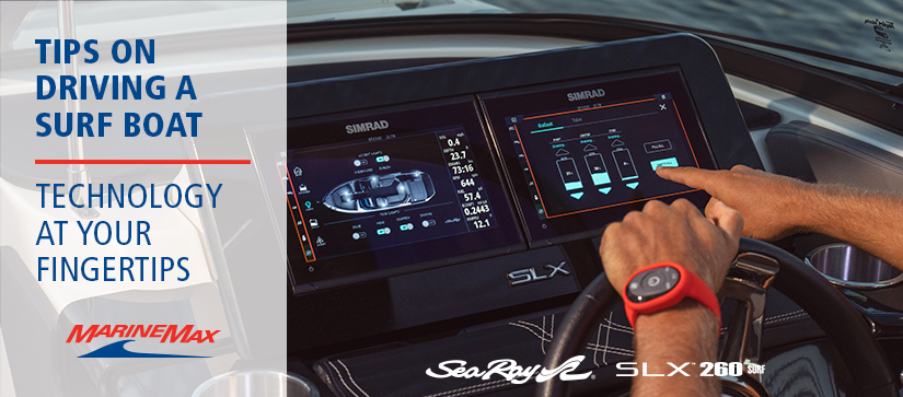 persons hands on the sea ray slx 260 surf helm with technology in the background