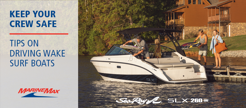 two people on a dock next to sea ray boat
