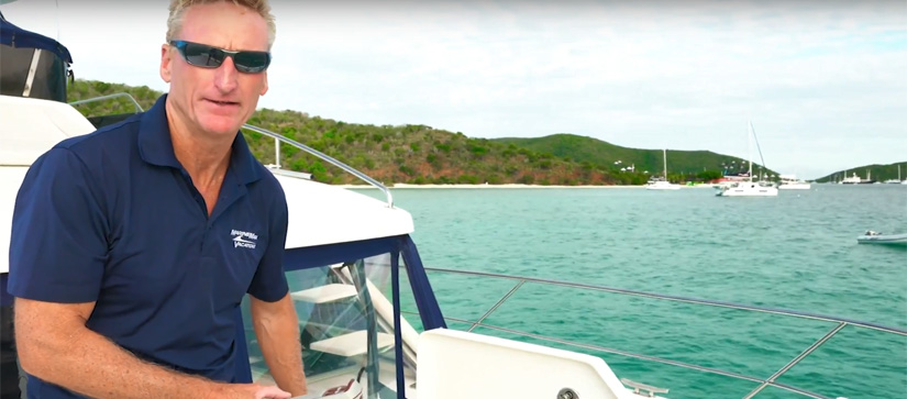Man on board of a boat - Boating Tip Video for Anchoring with a Windlass