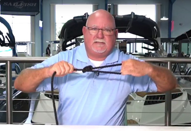 Man golding a rope - Boating Tips Video for Bowline Knot