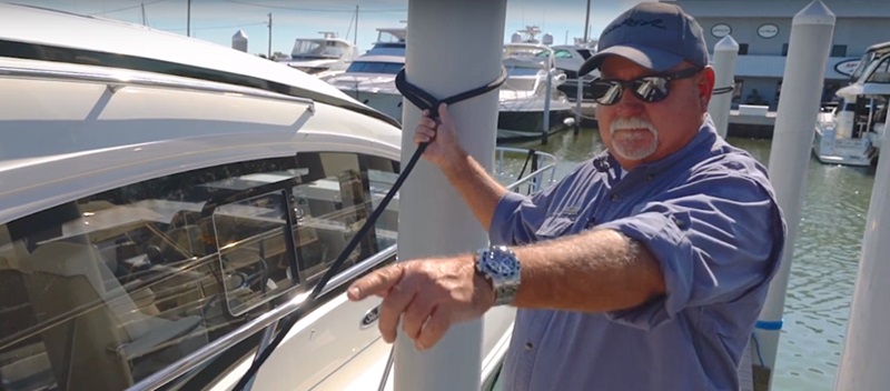 Captain Keith on the docks, tying up a Sea Ray Sundancer 400