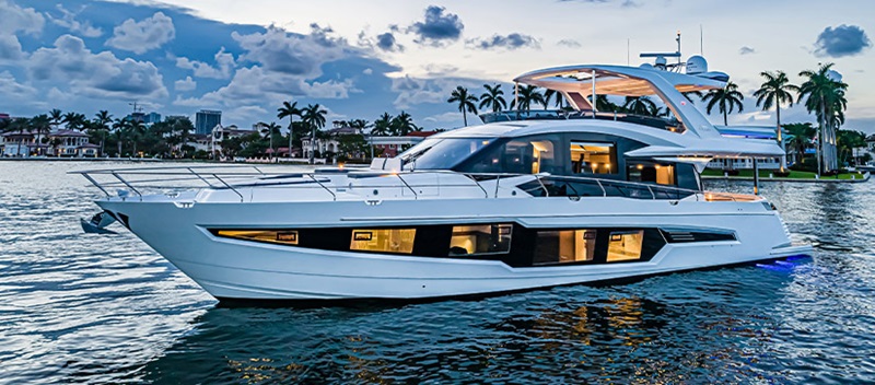 A Galeon 680 Fly at dusk with the interior lights on
