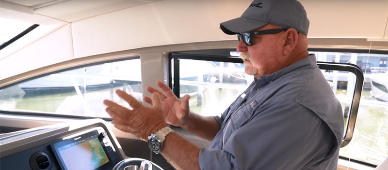 Man talking and moving his hands - MarineMax Boating Tips Video About Cummins Inboard Joystick