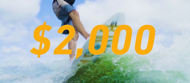 A graphic saying "$2,000" with a surfer in the background