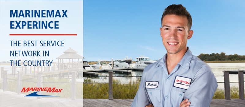 MarineMax Service technician smiling with water in background