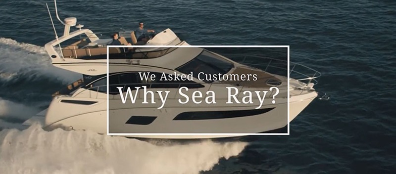 A Sea Ray boat in the water with a graphic in front of it saying, "We asked customers: Why Sea Ray?"