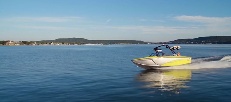 A Tige boat cruising on the water