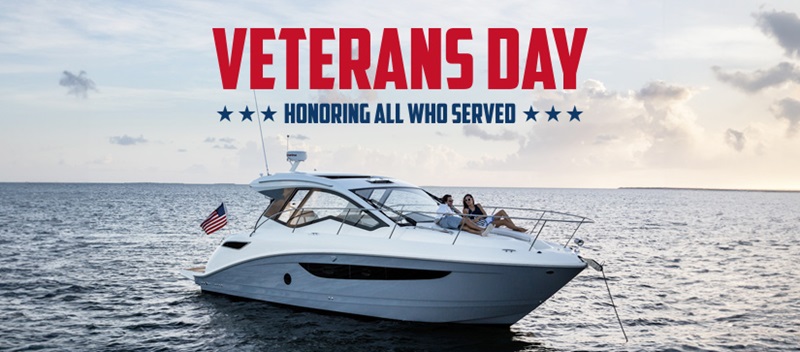 Veterans Day honoring all who served text with a boat on the water