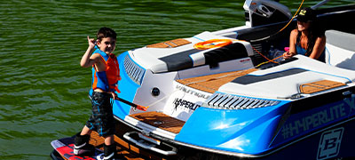 boy on the back of a boat