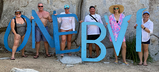 group of people with One BVI sign