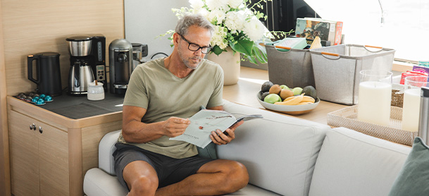 man reading on a boat