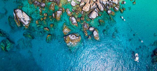 Aerial view of The Baths with clear blue waters