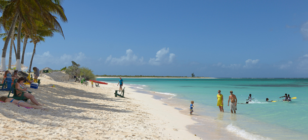 Anegada beach with people in the water and sand