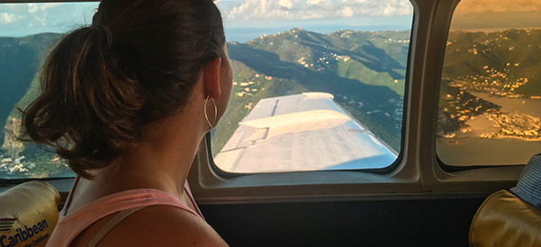 Lady looking at plane window