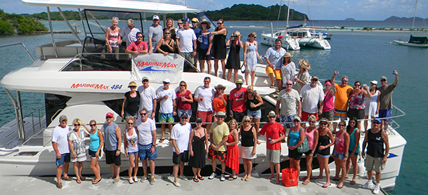 Big group on power catamaran and docks