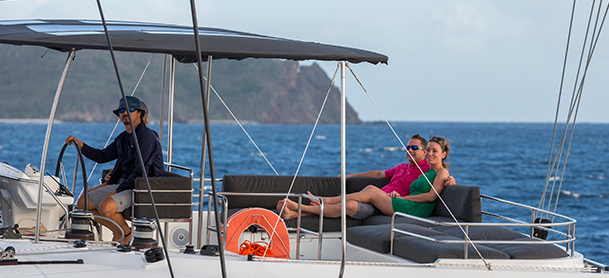 Couple on crewed sail yacht