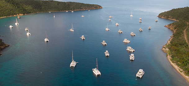 boats anchored in the water in the BVI