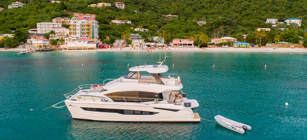 MarineMax Vacation charter boat in the water in front of Cane Garden Bay